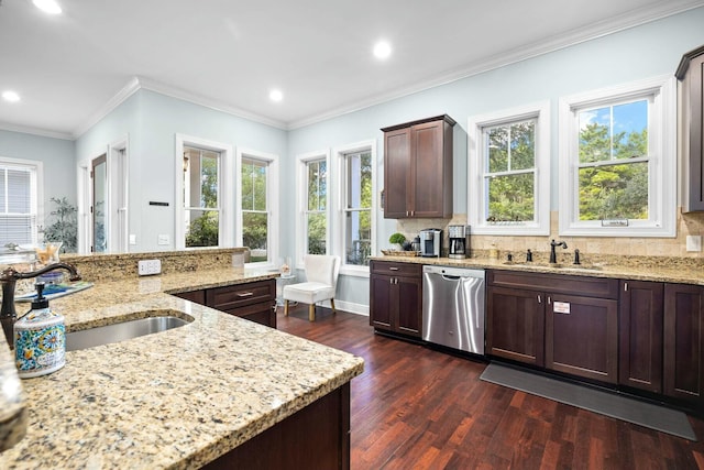 kitchen with dark hardwood / wood-style flooring, tasteful backsplash, light stone counters, sink, and dishwasher