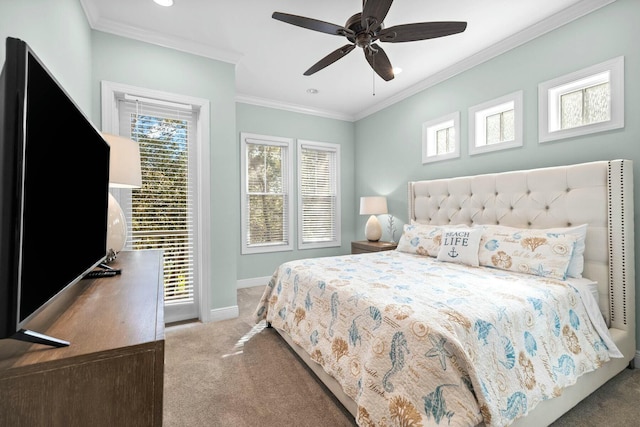 carpeted bedroom featuring ceiling fan and ornamental molding