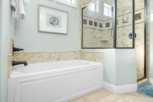 bathroom with tile patterned floors and separate shower and tub