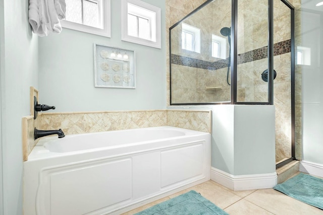 bathroom with separate shower and tub, tile patterned floors, and a wealth of natural light