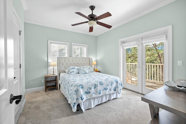 carpeted bedroom featuring access to exterior, ceiling fan, and ornamental molding