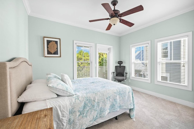 bedroom featuring ceiling fan, carpet floors, and ornamental molding