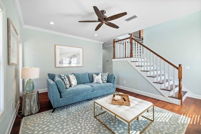 living room with ceiling fan, crown molding, and wood-type flooring