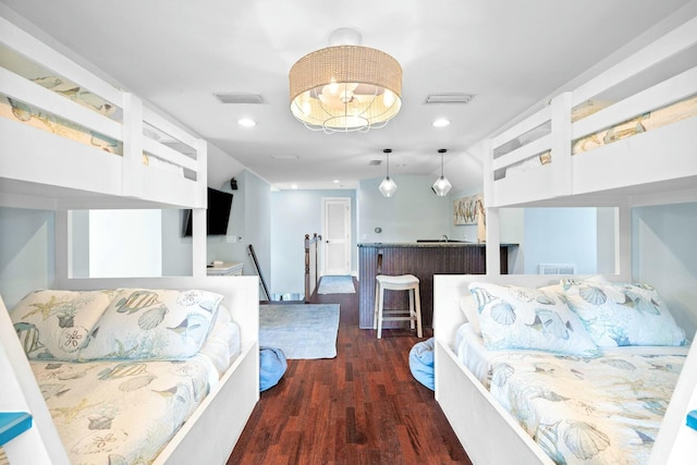 bedroom featuring dark wood-type flooring and lofted ceiling