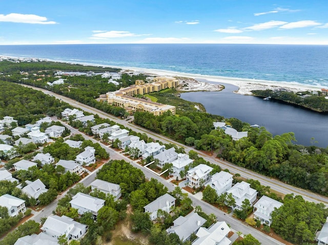 birds eye view of property featuring a water view and a view of the beach