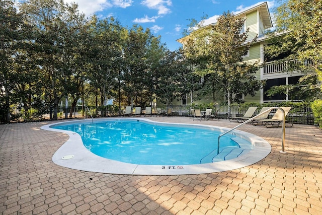 view of pool featuring a patio