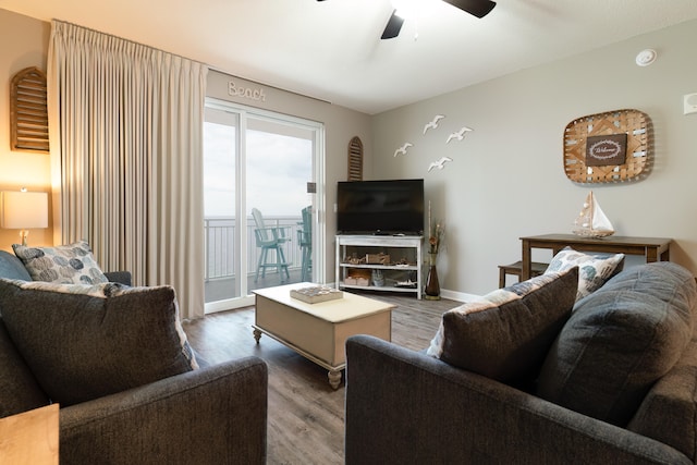 living room with ceiling fan and hardwood / wood-style floors