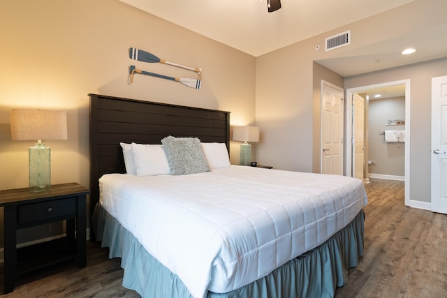 bedroom featuring dark hardwood / wood-style flooring and ceiling fan