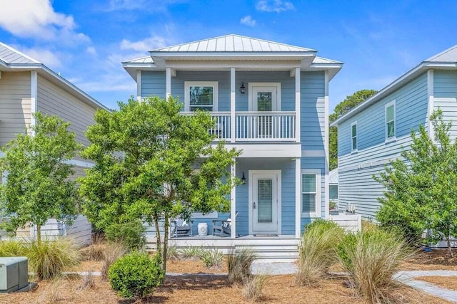 view of front of home featuring a balcony and a porch