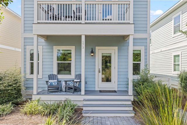 entrance to property with a balcony