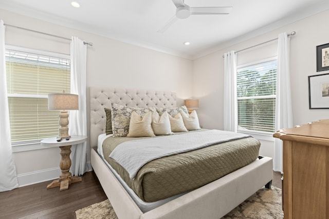 bedroom with ornamental molding, ceiling fan, and dark hardwood / wood-style flooring