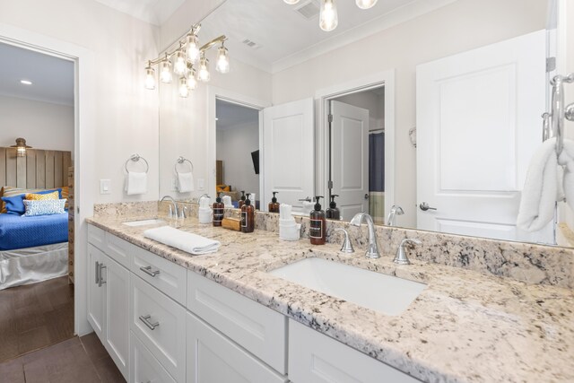 bathroom with hardwood / wood-style floors and vanity