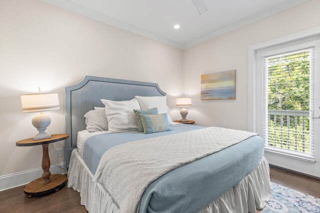 bedroom featuring ceiling fan, dark wood-type flooring, and crown molding