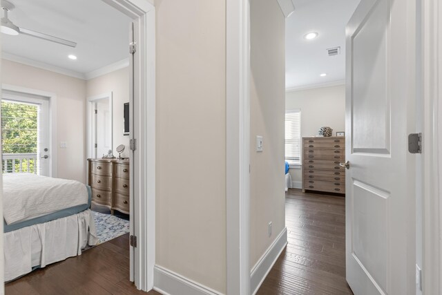 bedroom with ceiling fan, dark hardwood / wood-style floors, and crown molding