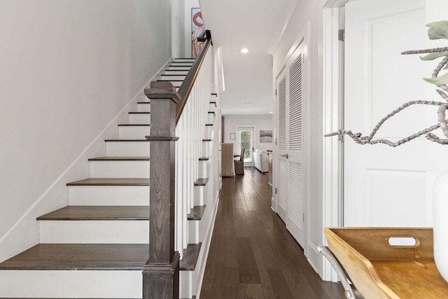 stairs featuring wood-type flooring