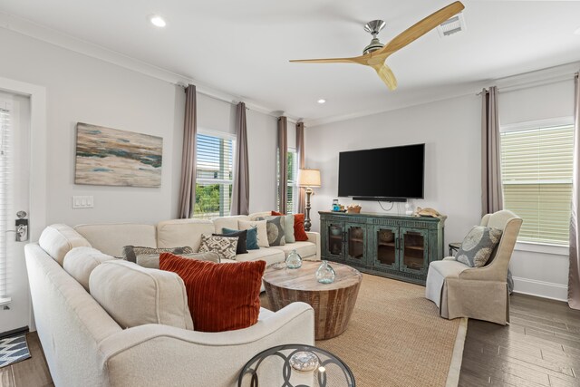 living room featuring ornamental molding, ceiling fan, and hardwood / wood-style flooring