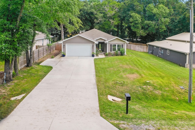 ranch-style house featuring a front yard and a garage