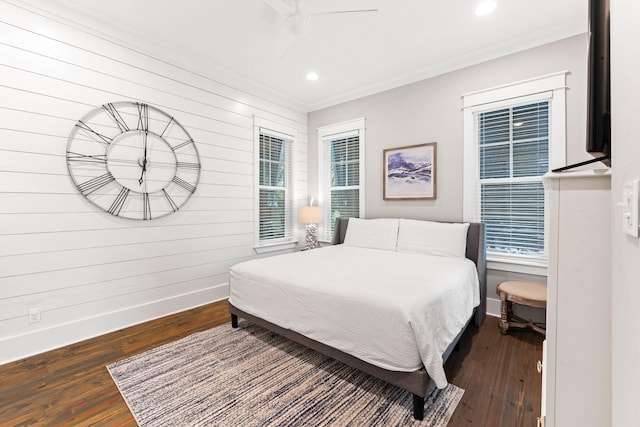 bedroom with dark wood-type flooring, ceiling fan, and multiple windows