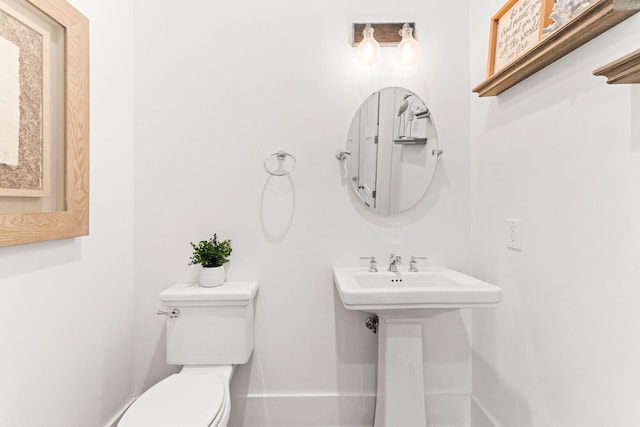 bathroom with toilet and sink