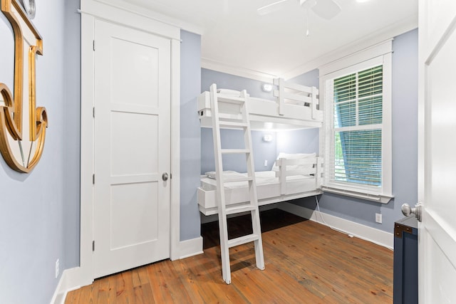 bedroom featuring hardwood / wood-style flooring and ceiling fan