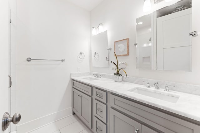 bathroom with vanity, tile patterned floors, and walk in shower