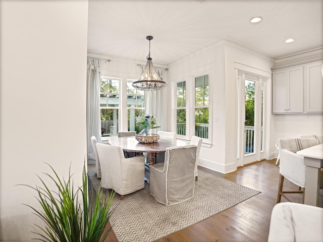 47 Trail Ln, Santa Rosa Beach, FL 32459 - dining space with a chandelier, wood finished floors, ornamental molding, and recessed lighting