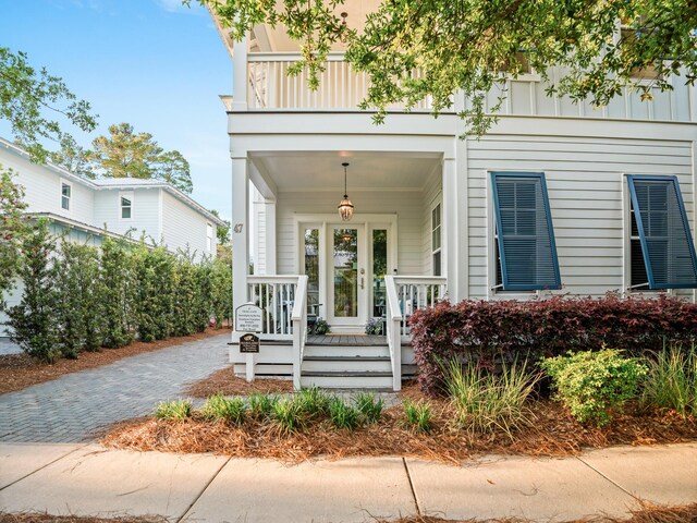 47 Trail Ln, Santa Rosa Beach, FL 32459 - property entrance with a porch and board and batten siding