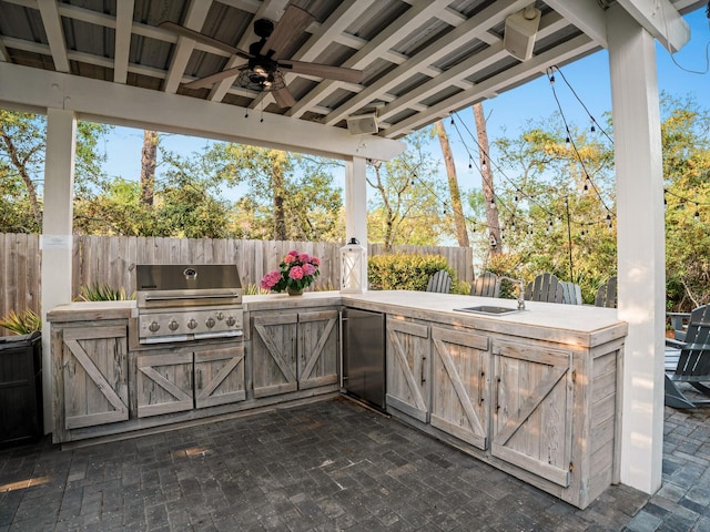 47 Trail Ln, Santa Rosa Beach, FL 32459 - fenced backyard with an outdoor kitchen, ceiling fan, and a patio