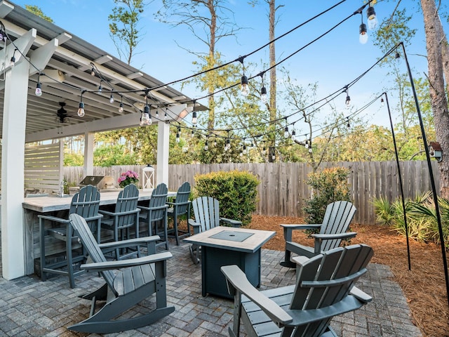 47 Trail Ln, Santa Rosa Beach, FL 32459 - fenced backyard featuring an outdoor fire pit, ceiling fan, and a patio area
