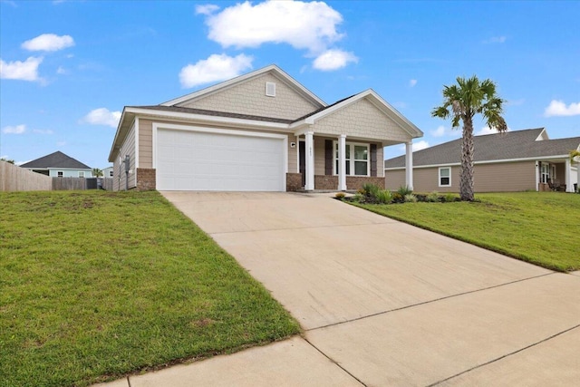 view of front facade featuring a garage and a front lawn