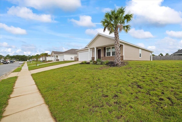 view of front of house featuring a garage and a front yard