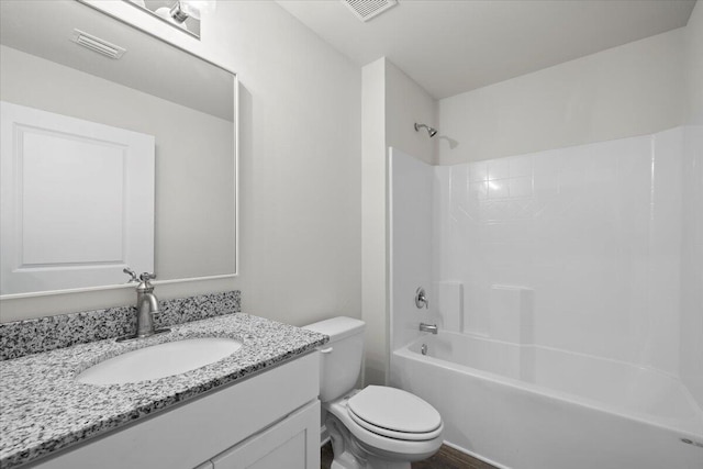 full bathroom with vanity, toilet, and shower / washtub combination