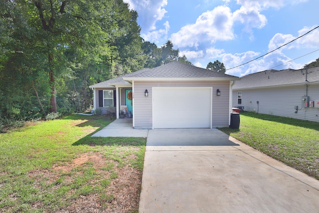 single story home featuring a garage and a front lawn