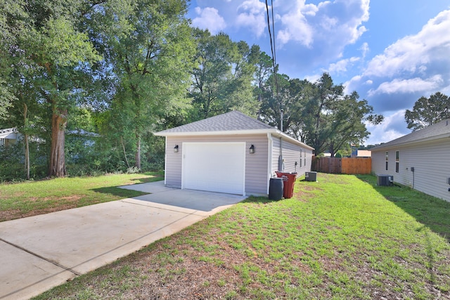 view of property exterior featuring a yard, a garage, an outdoor structure, and central air condition unit