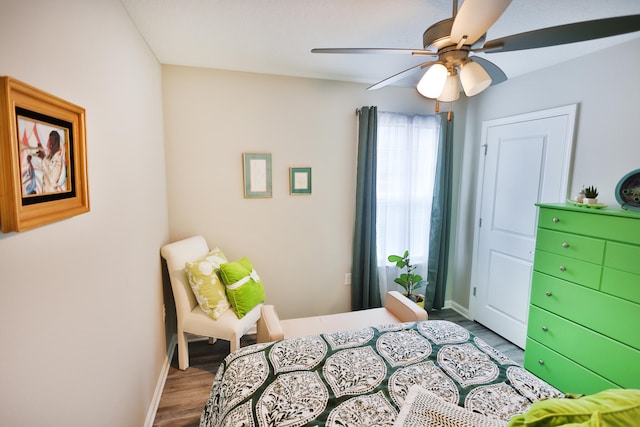 bedroom with ceiling fan and hardwood / wood-style flooring