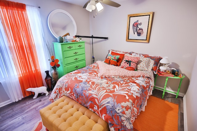 bedroom featuring wood-type flooring and ceiling fan