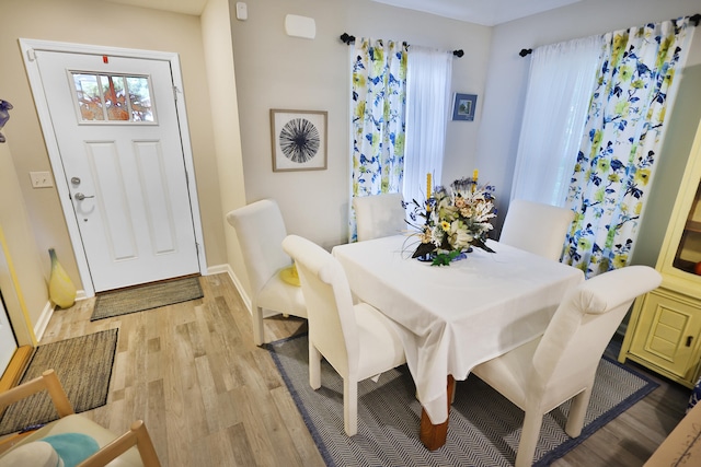 dining area with light wood-type flooring