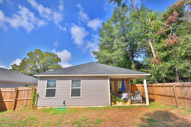 back of property featuring a patio