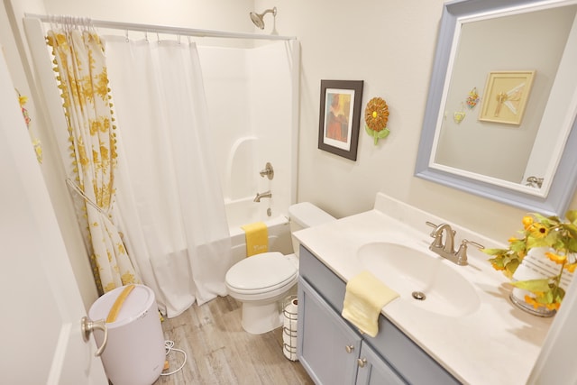 full bathroom featuring vanity, shower / tub combo, toilet, and hardwood / wood-style flooring