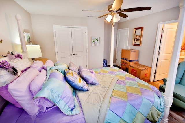 bedroom featuring ceiling fan, hardwood / wood-style flooring, and a closet