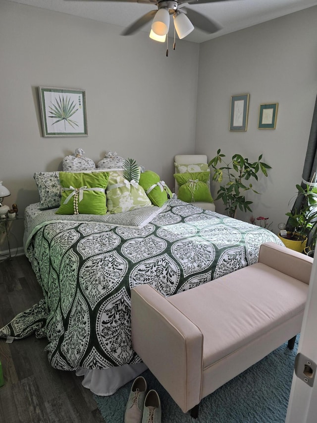 bedroom featuring hardwood / wood-style flooring and ceiling fan