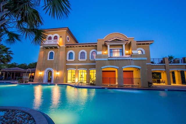 view of swimming pool featuring a patio and pool water feature