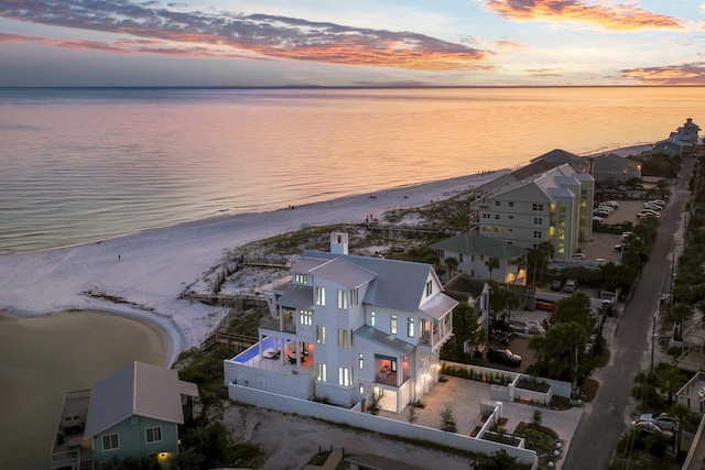 bird's eye view featuring a water view, a residential view, and a beach view