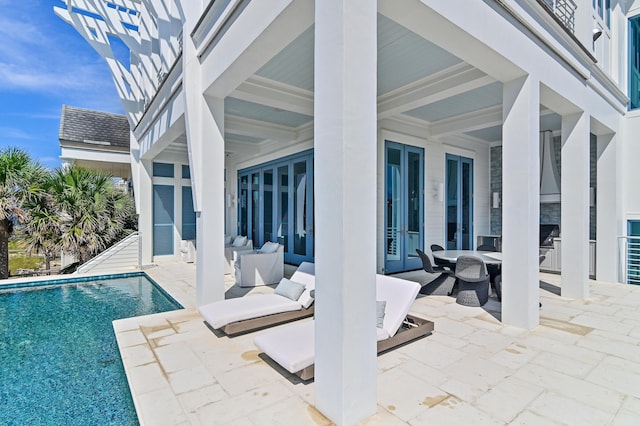 pool featuring outdoor dining space and a patio