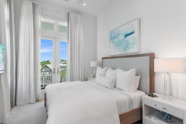 bedroom featuring access to outside, french doors, light colored carpet, and recessed lighting