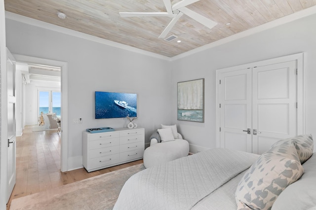 bedroom with a ceiling fan, wood ceiling, visible vents, and light wood finished floors