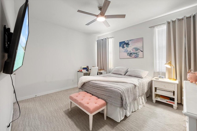 bedroom featuring light carpet and ceiling fan