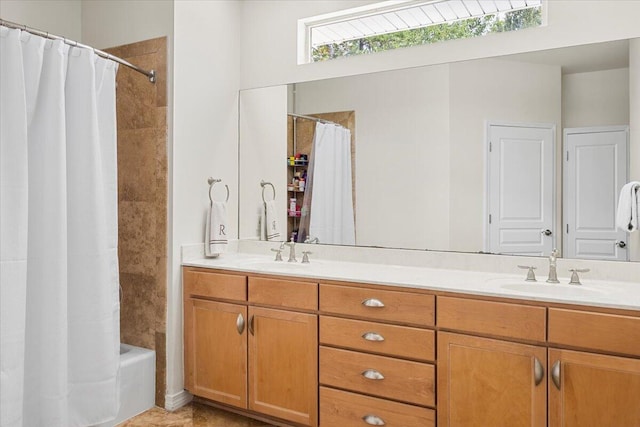 bathroom featuring vanity and shower / bathtub combination with curtain