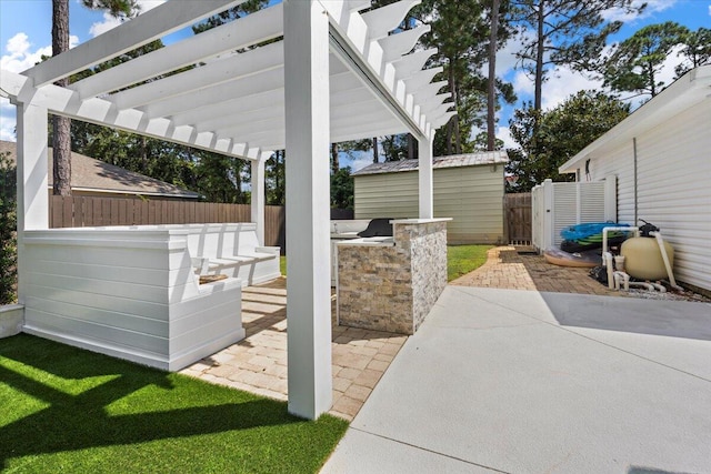 view of patio / terrace featuring a pergola and exterior kitchen