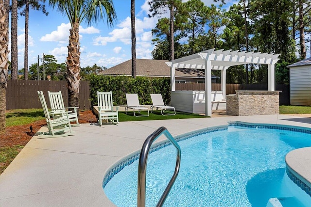 view of pool with a pergola and a patio area